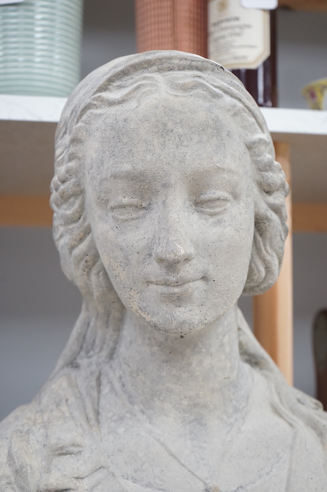 A composition stone bust of Madonna, 48cm high